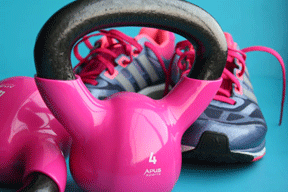 Pink kettlebells are a cute complement to pink-laced cross-training shoes.